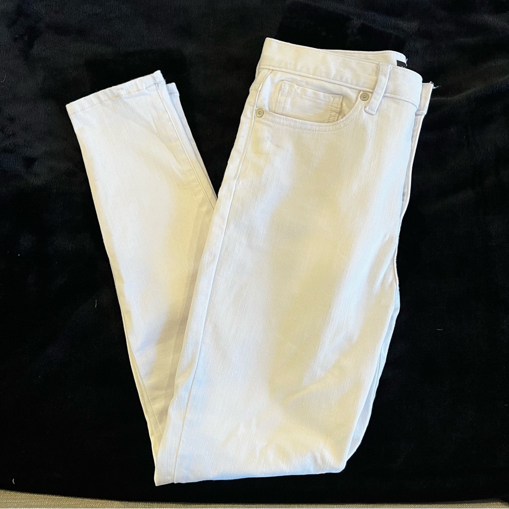 Button fly high rise skinny white jeans